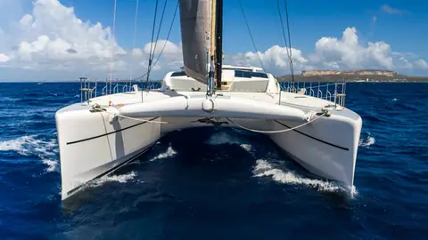 Catana 90 Orion seen head on showing both hulls, the trampoline and carbon rig