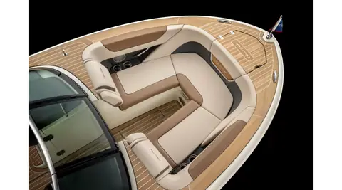 Chris-Craft Launch 27 bow lounge with wraparound cushioned seating and teak style decking