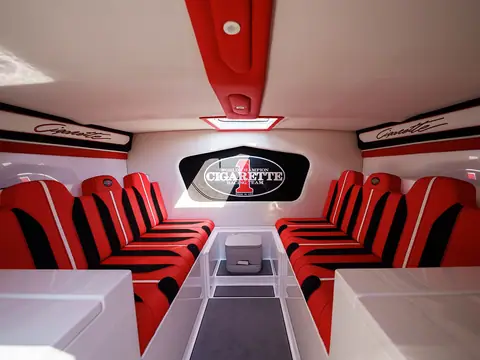 Cigarette 515 cabin with red and white upholstered settees on both sides