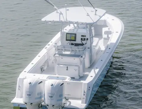 Contender 32 ST seen from above and astern with twin outboards and console