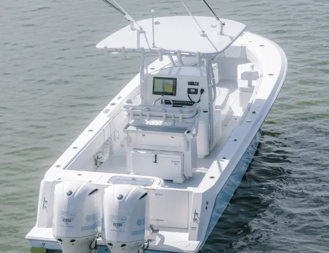 Contender 32 ST seen from above and astern with twin outboards and console