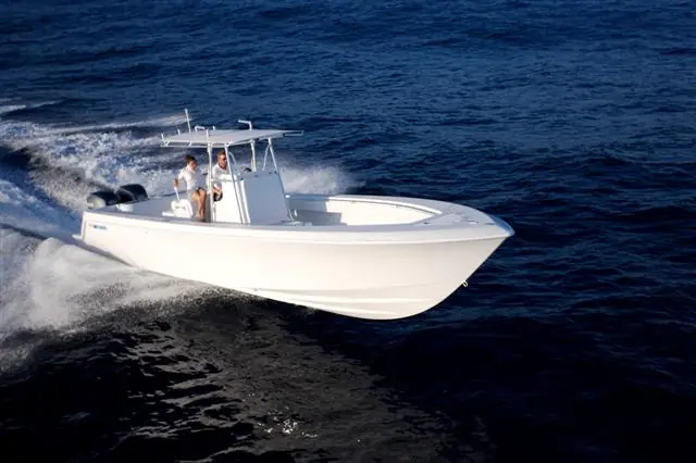 Contender 33 Tournament running on dark blue water with two people at the console