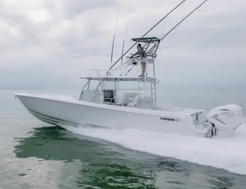 Contender 44 ST running with quad outboards and a tower helm