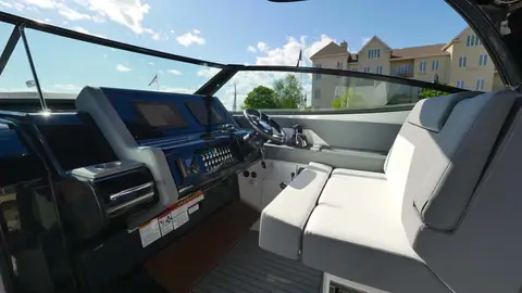 Cruisers Yachts 38 GLS helm with twin displays and companion seating under the hardtop