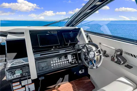 Cruisers Yachts 42 GLS dashboard with twin displays, wheel and engine controls