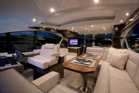 Cruisers Yachts 50 Cantius main salon with helm, dinette and wraparound windows
