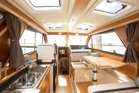Cutwater C28 cabin with galley, dinette and cherry joinery