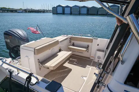 Cutwater C248 Coupe cockpit with transom seating and a Yamaha outboard