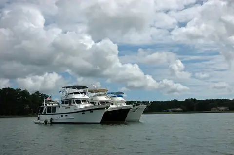 Three DeFever 49 Pilothouse trawlers rafted together at anchor