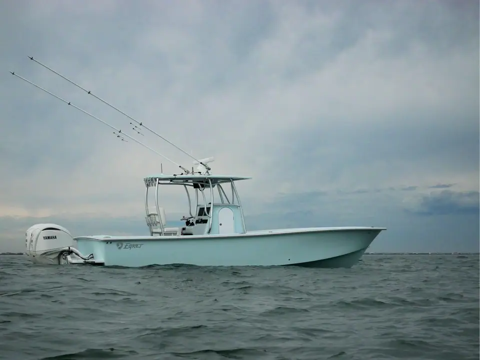 Egret 29 Offshore in profile with its T top and twin Yamaha outboards on a bracket
