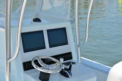 Egret 29 Offshore helm console with twin displays and a stainless wheel