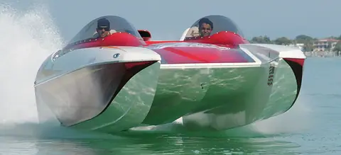 Eliminator 25 Daytona catamaran running fast with twin canopies over the cockpit