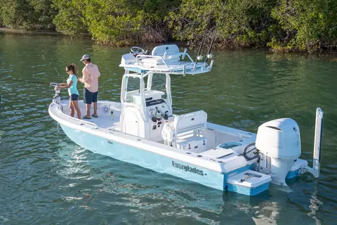Everglades 243CC drifting near mangroves with anglers on the bow and a shallow water anchor