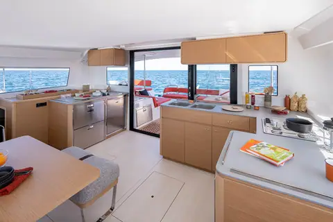 Excess 14 saloon with galley, dinette and wraparound windows