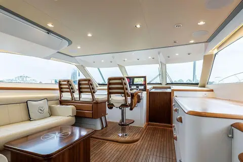 F&S express Soul Candy bridge deck with helm seats, settee and teak table