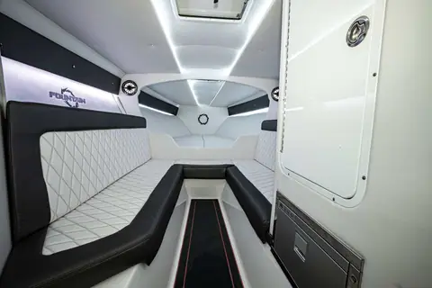 Fountain 47 Lightning cabin with a white leather lounge and overhead hatch