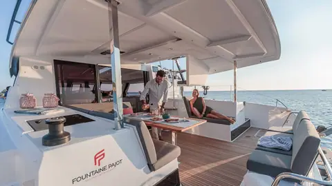 Fountaine Pajot Isla 40 aft cockpit with dining table, lounge seating and hardtop