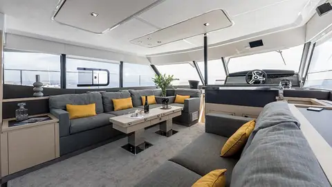 Fountaine Pajot MY 44 saloon with sofas, coffee table and forward helm