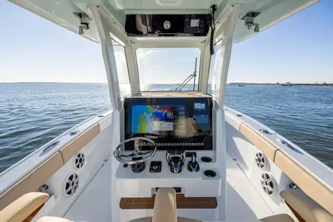 Freeman 29 helm console with a large display, wheel and throttles