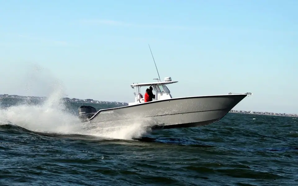 Freeman 34VH running fast with spray off its twin hulls