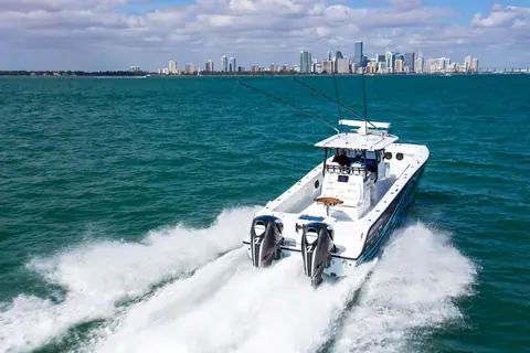 Freeman 37VH running off the Miami skyline seen from astern