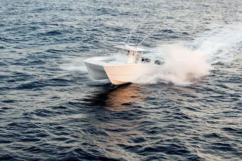 Freeman 37VH turning hard across open water with its twin hulls visible