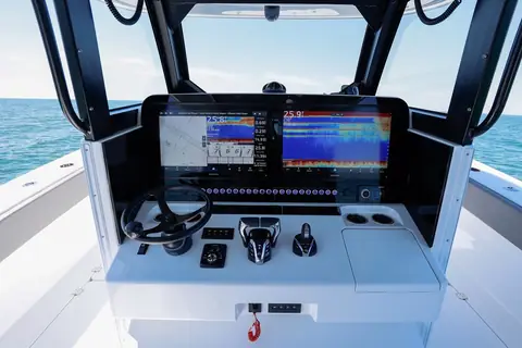 Freeman 43 helm console with large displays and a wheel