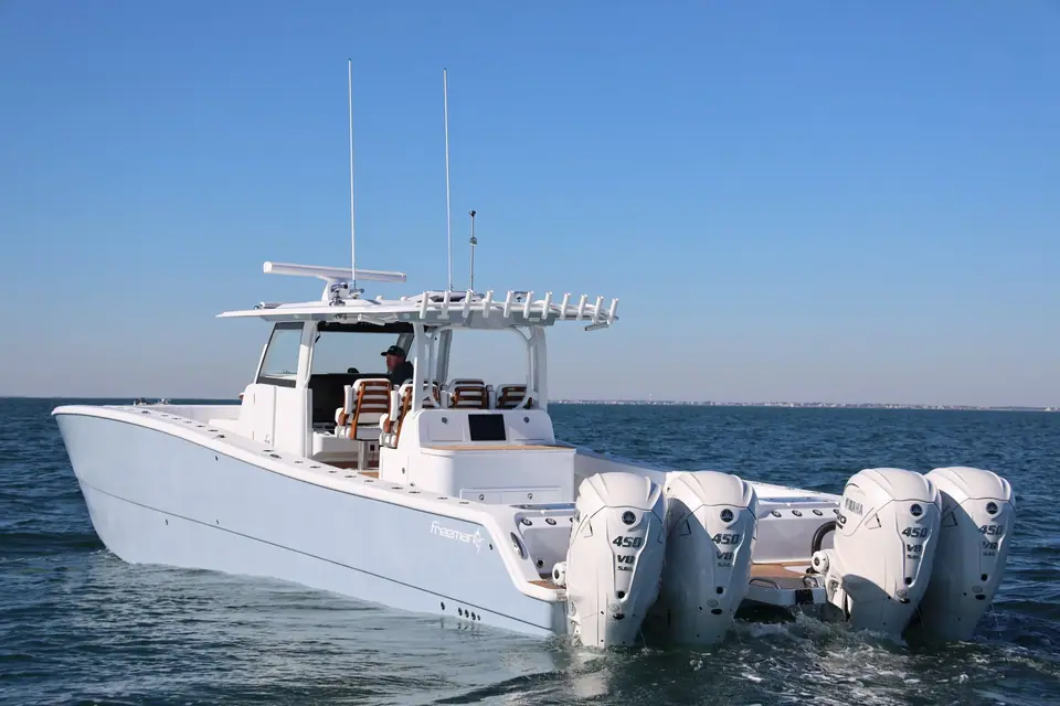 Freeman 47 from the stern quarter showing its catamaran hull and quad outboards