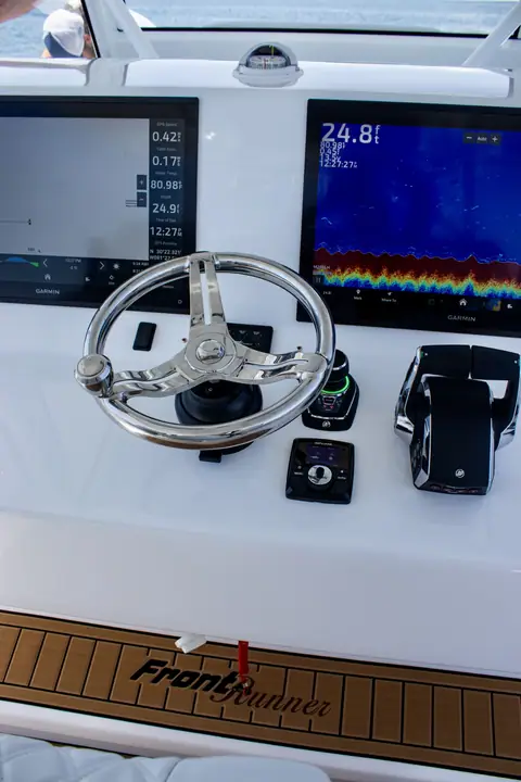 Helm of the Front Runner 43 Cat with twin displays and stainless wheel