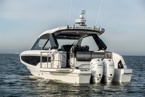 Stern view of the Galeon 325 GTO showing the hardtop, swim platform and twin Mercury outboards