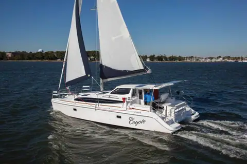 Gemini 105Mc catamaran sailing under main and jib with its cockpit hardtop