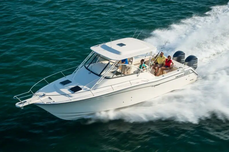 Grady-White Express 330 cruising at speed with guests under the hardtop