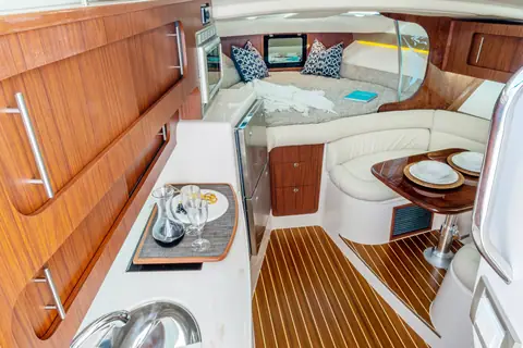 Cabin of the Grady-White Express 370 with teak sole, dinette and forward berth