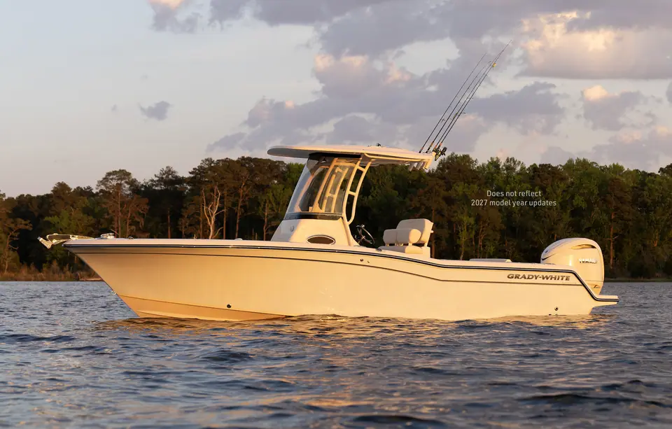 Grady-White Fisherman 236 at rest in profile with its T top and single outboard