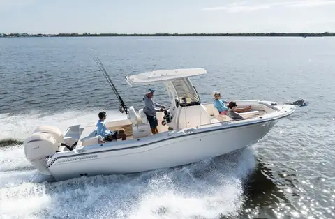 Grady-White Fisherman 257 center console running fast with anglers aboard and twin outboards