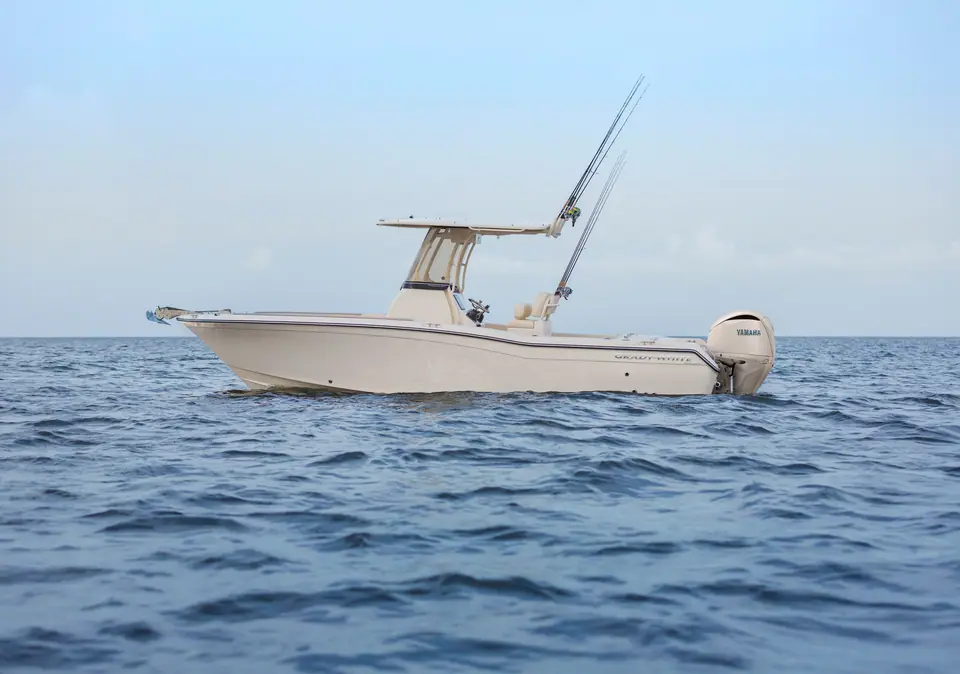 Grady-White Fisherman 257 at rest in profile with its T top and outriggers