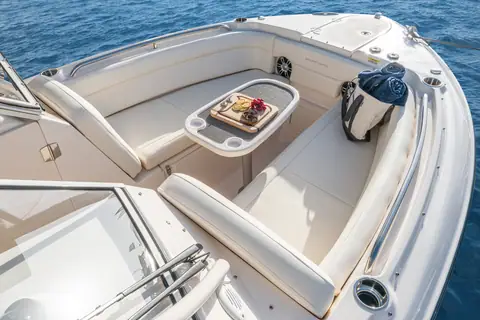 Bow seating of the Grady-White Freedom 275 with table and wraparound lounges