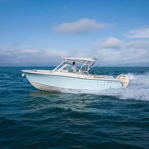 Grady-White Freedom 285 running fast through light chop