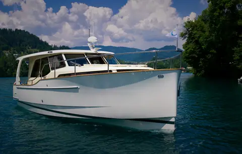 Greenline 33 seen from ahead, showing the plumb stem and the hardtop
