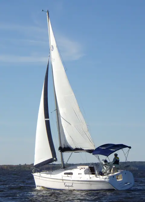 Hunter 27 sailing with a bimini over the cockpit