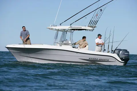 Hydra Sports 2500 CC drifting in profile with three anglers fishing from the deck