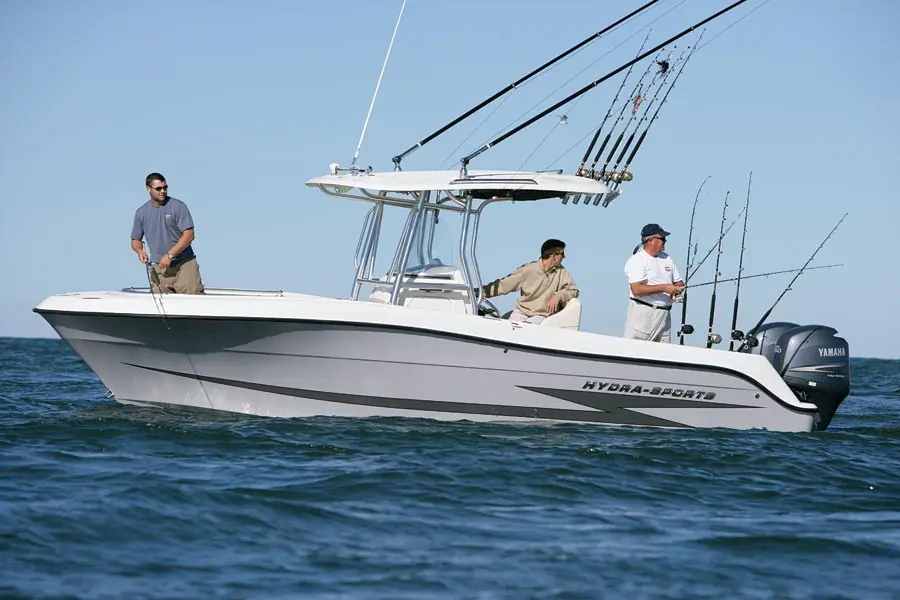 Hydra Sports 2500 CC drifting in profile with three anglers fishing from the deck