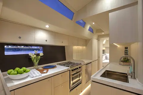 Hylas H60 galley with stove, oven and sink under the coachroof windows