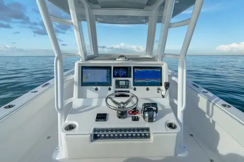 Invincible 33 Catamaran helm with twin displays under the T top