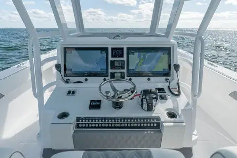 Invincible 40 Catamaran helm console with twin displays and the wheel
