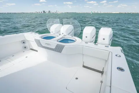 Invincible 40 Catamaran aft cockpit with livewells and outboards on the transom