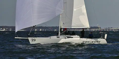 J/105 in profile flying a white gennaker from its retractable bowsprit