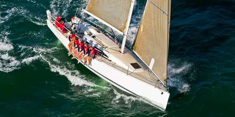 Overhead view of a J/111 deck with crew hiking on the windward rail