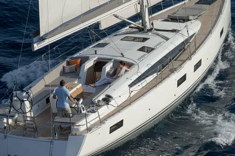 Jeanneau 54 cockpit and teak side decks seen from above while sailing