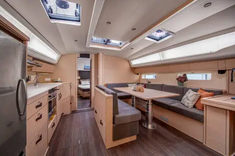 Jeanneau 54 saloon with galley to port and the dinette and settee to starboard